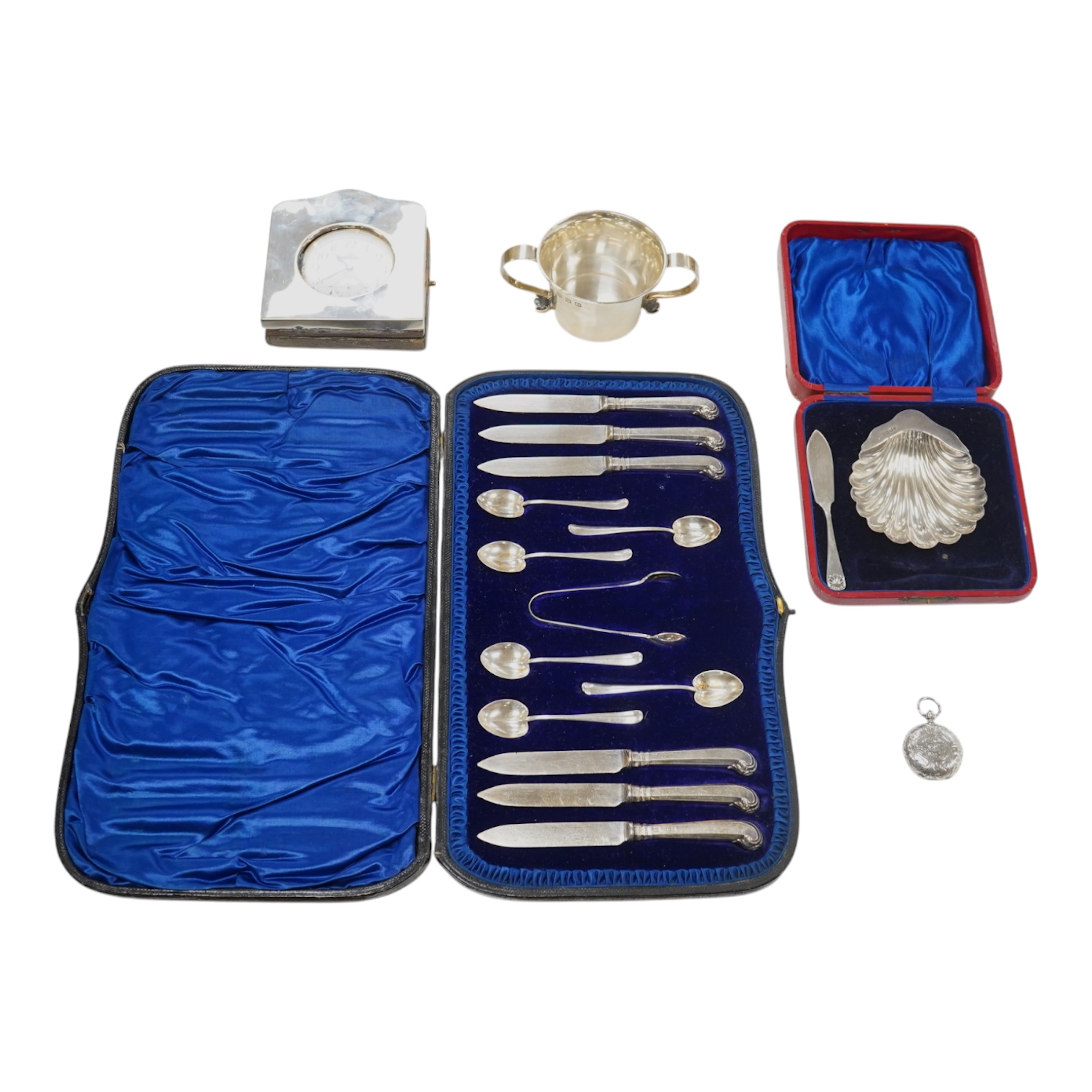 A George V Brittania standard silver two handled cup, Thomas Bradbury & Sons, Sheffield, 1922, height 49mm, two associated sections of a travelling watch case, with an Elkington nickel cased pocket watch, an Edwardian en